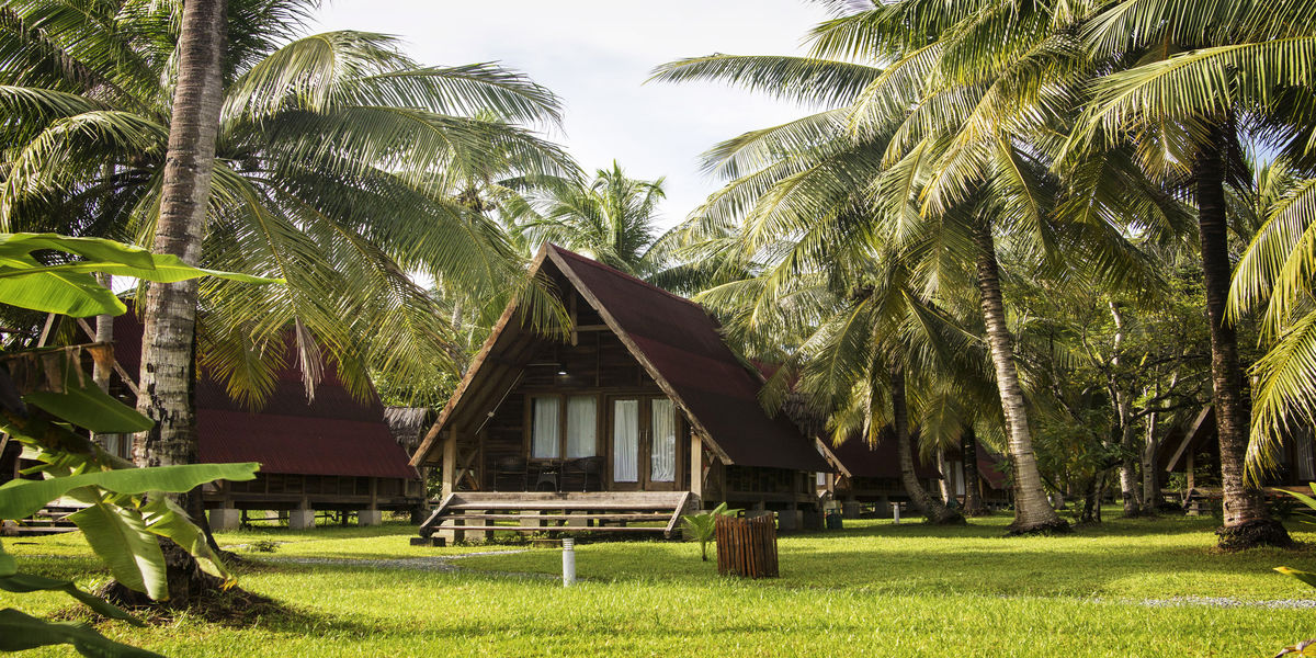 exotic luxury resort wooden houses hidden palm trees borneo sabah